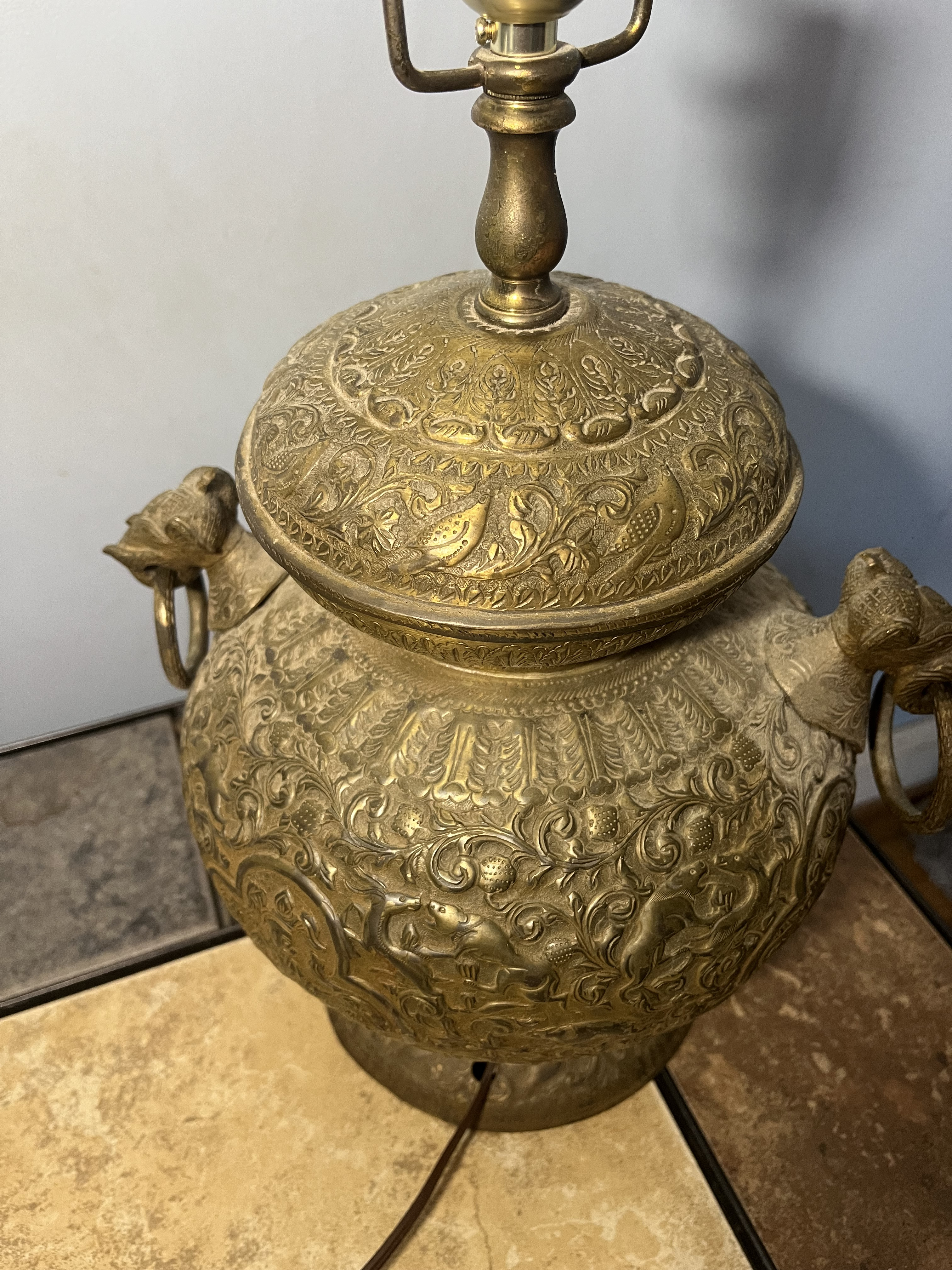 Brass lamp covered with Hindu Carvings
