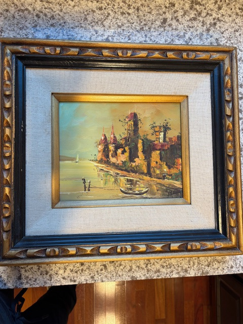 Painting of tower/castle on water with boat