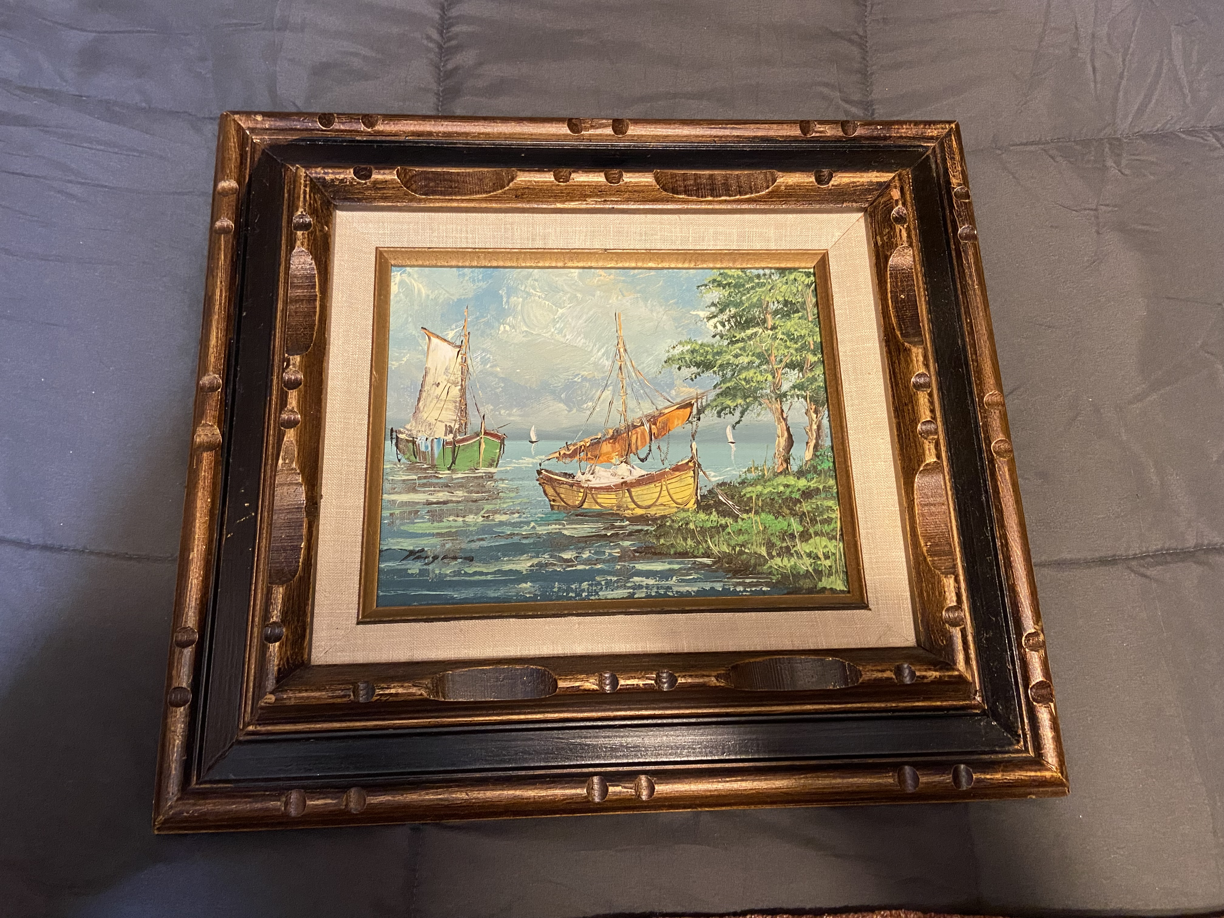 Vintage oil painting of sailboats in the bay 