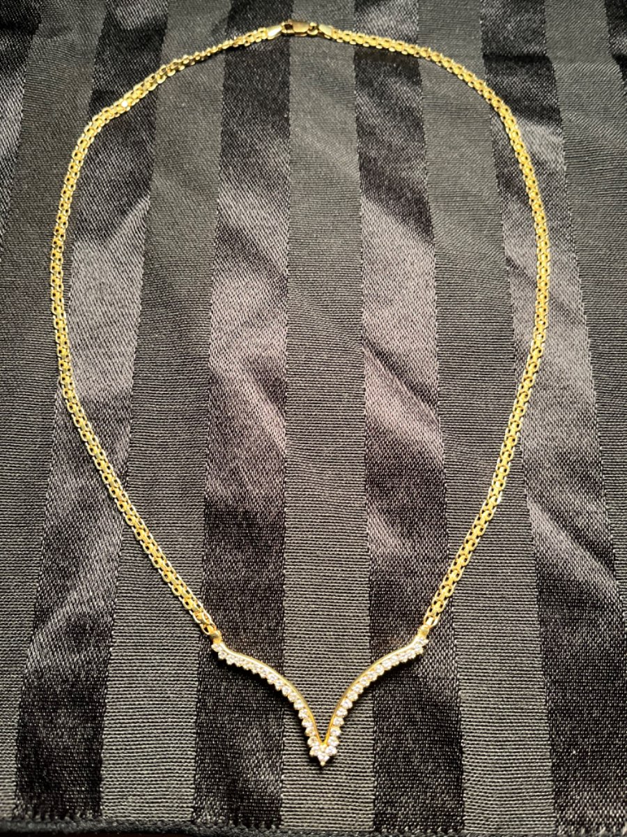14 karat gold, natural diamonds. Jane length 18 inches not including the V cut diamond area.