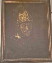 The man in the gold helmet