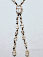 Glass beads scarabs, elephants Egyptian look, glows UV light, inherited in 1995, some wear to the brown color, no marks