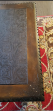 Tooled leather-top coffee table made by DeCoro, USA