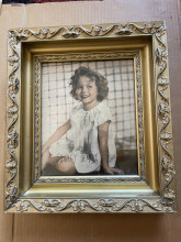 Antique gold guilded wood picture frame with a picture of Shirley temple dated 1936
