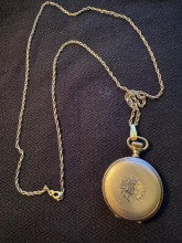 Gold pocket watch with chain