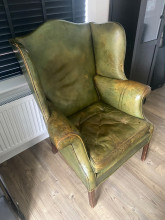 Vintage Green Leather Wingback Chair — estimated value $400–$600