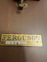 This is a vintage side table of some sort I believe, from an old furniture making company that