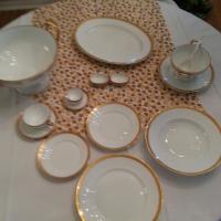 Place setting with dinner,salad,bread plates, soup bowls, coffee and deitiase cups