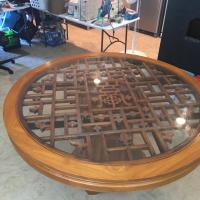 Table top that is hand carved and the glass is extremely heavy, and beveled.