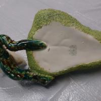 Back has stamp and writen  125    marked on it.  Can only make out a Thomas on the second line of the stamp