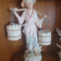 vintage set of porcelain chinese man and woman carrying water buckets