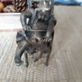 Bronze girl in highchair