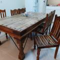 Rustic wooden dining table with chairs
